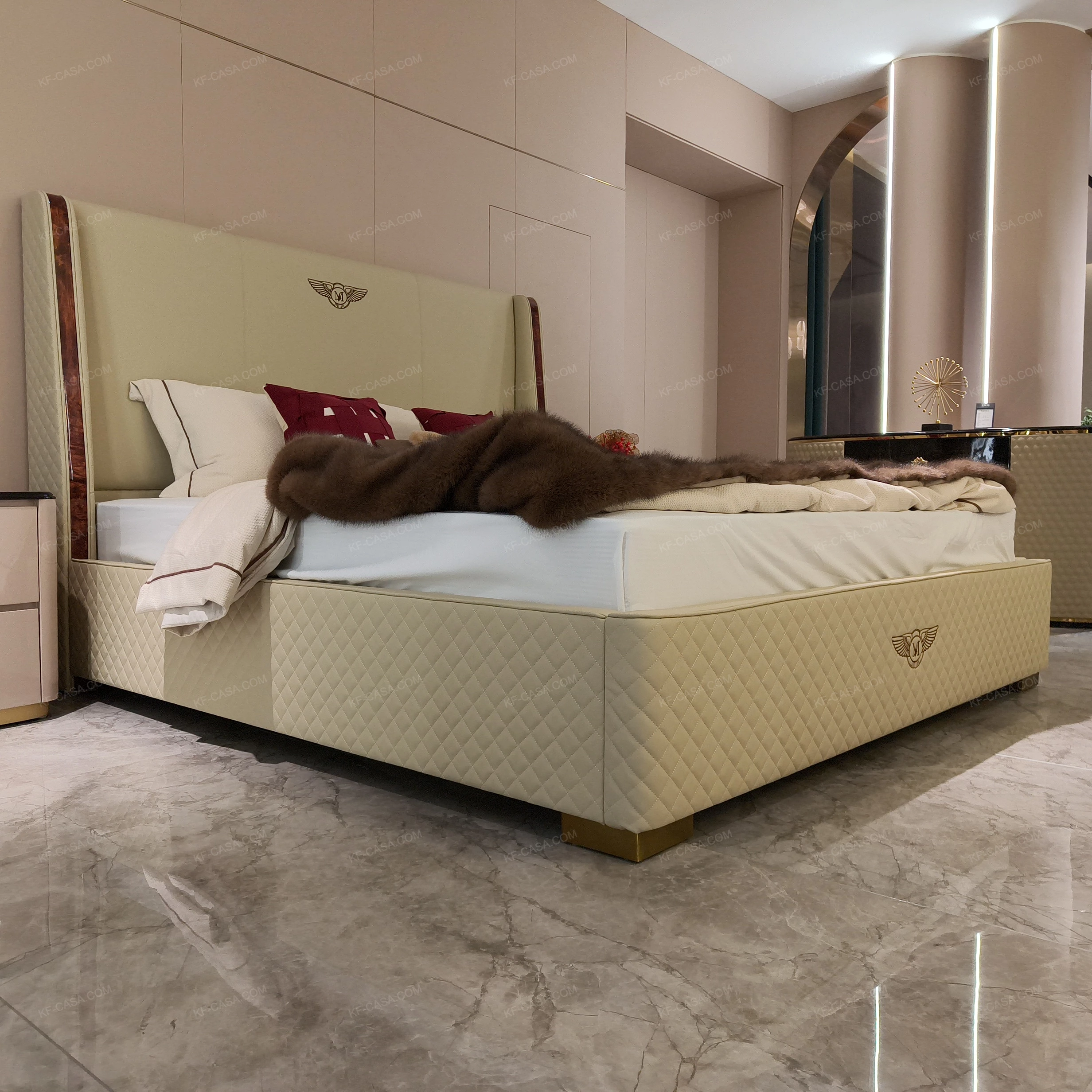 Light Beige Upholstered Bed with Quilted Texture, Natural Wood Veneer Trim & Metal Emblem Accents